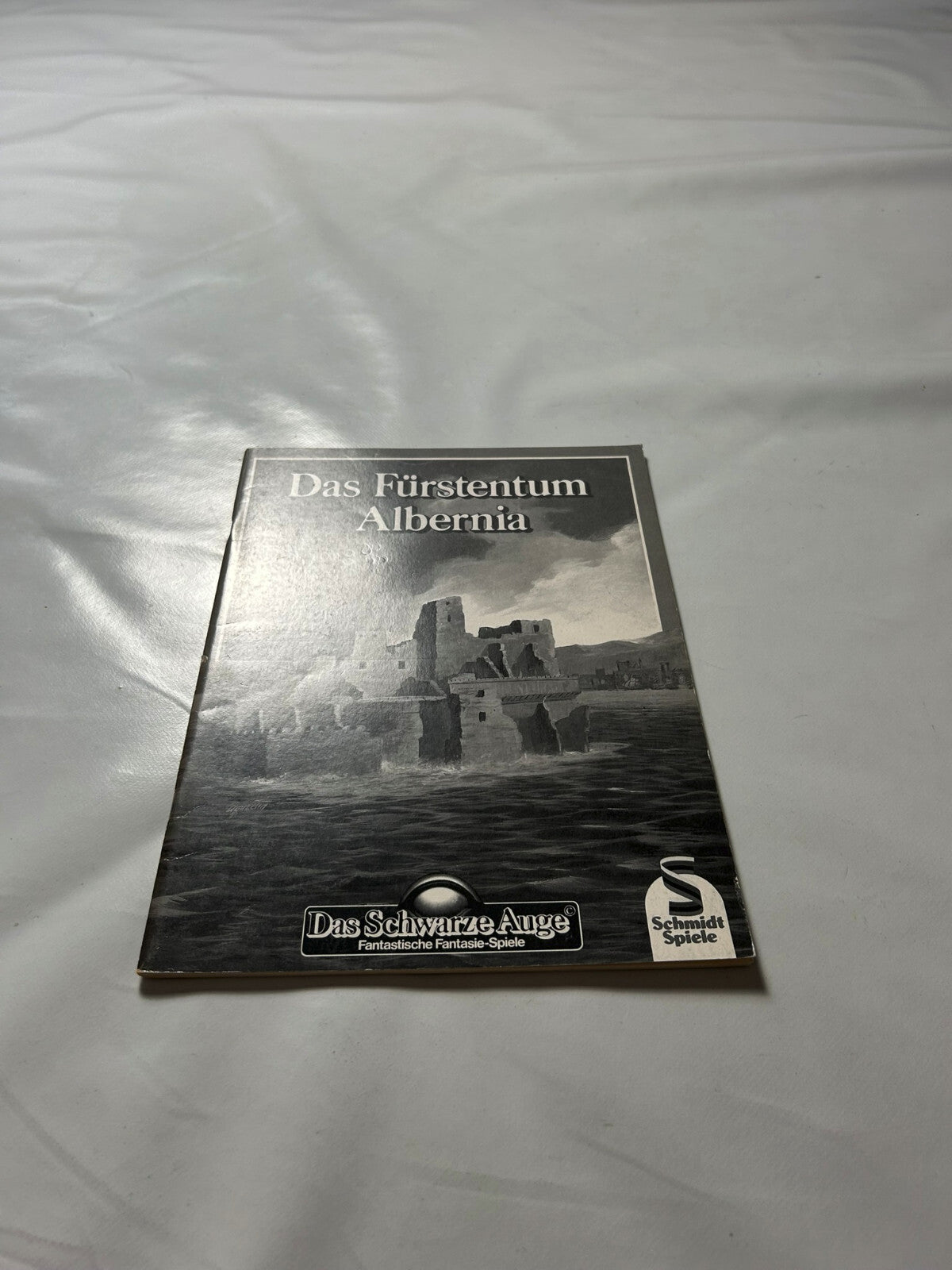 7027184